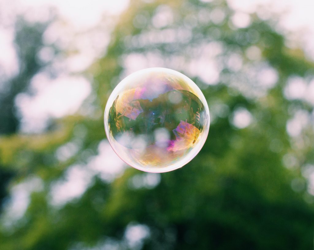 a bubble with blurred tree in background